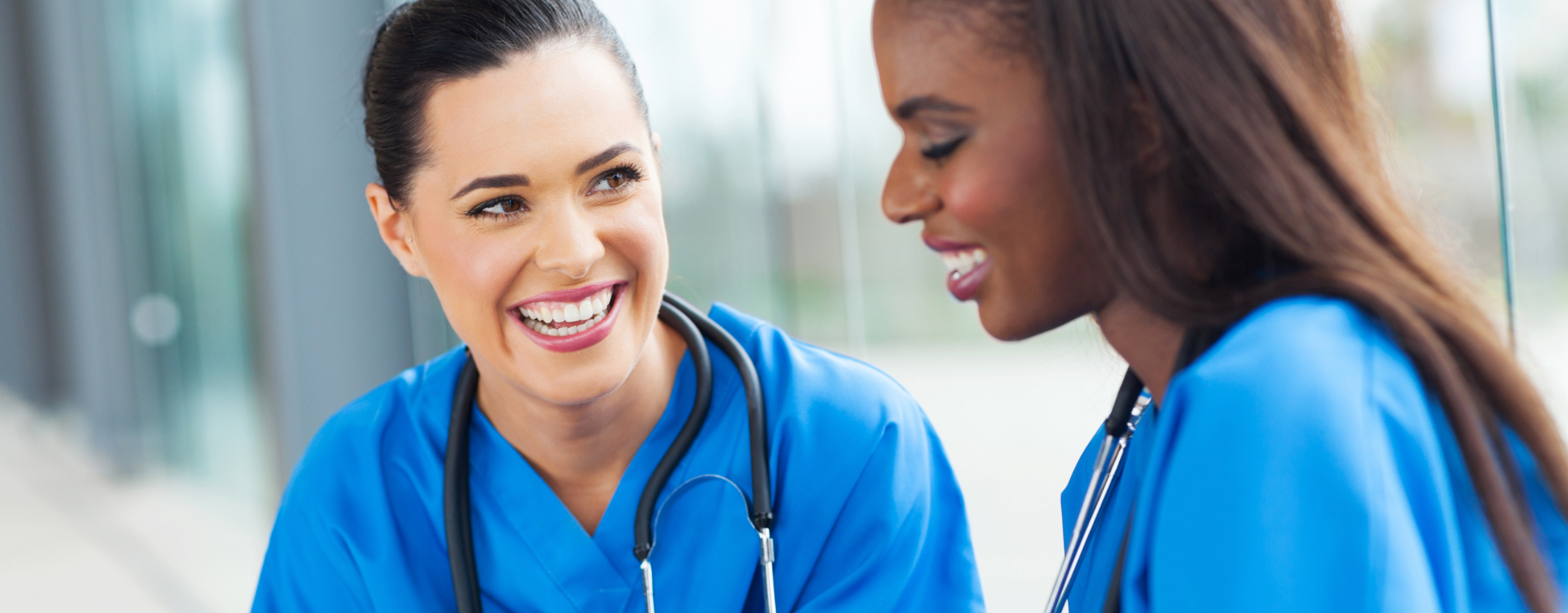 Two smiling medical students