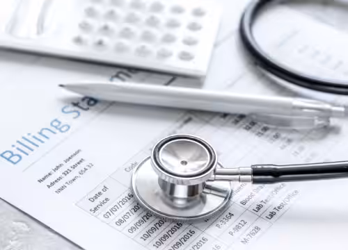 billing statement for for medical service in doctor's office on stone desk background