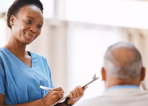 Photo of a medical assistant with a patient